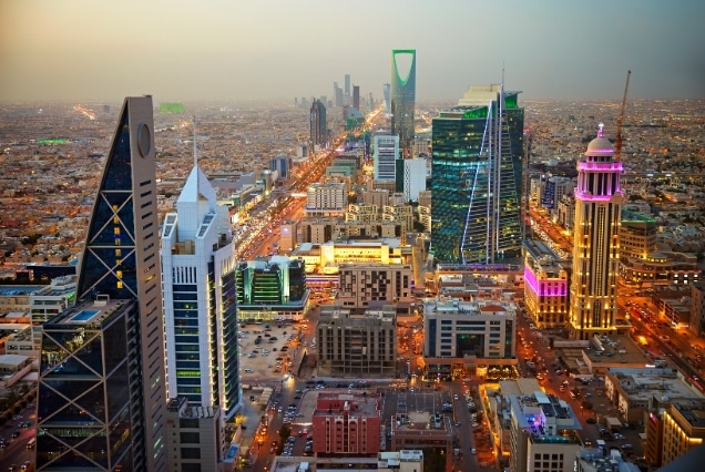 Aerial sunset view of Riyadh skyline featuring Kingdom Centre tower, optimized for Saudi Arabia e-visa services from Dubai UAE.