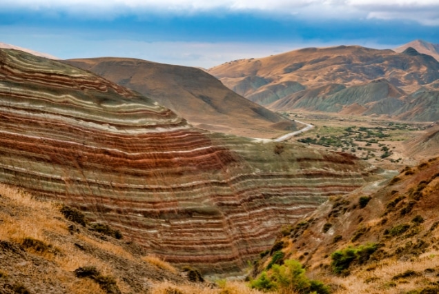 Vibrant red and white striped shale layers of the Candy Cane Mountains in Khizi, Azerbaijan, a popular day-trip destination for UAE travelers.