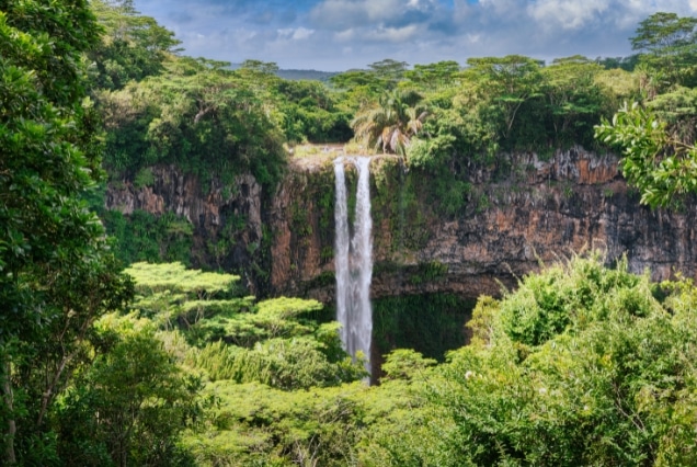 Chamarel Waterfall in Mauritius surrounded by lush tropical jungle, holiday package from Dubai.