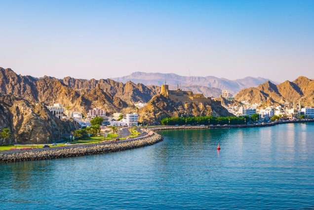 Scenic view of Muttrah Corniche and fort in Muscat, Oman, representing Oman e-visa services for UAE residents in Dubai.