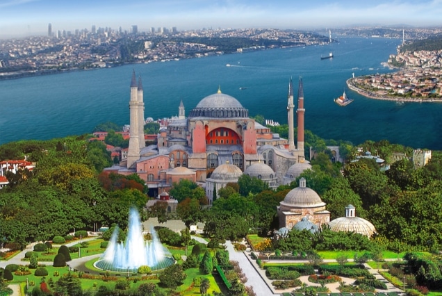 Hagia Sophia in Istanbul with garden fountain and Bosphorus view; featured in Turkey tour packages from Dubai.