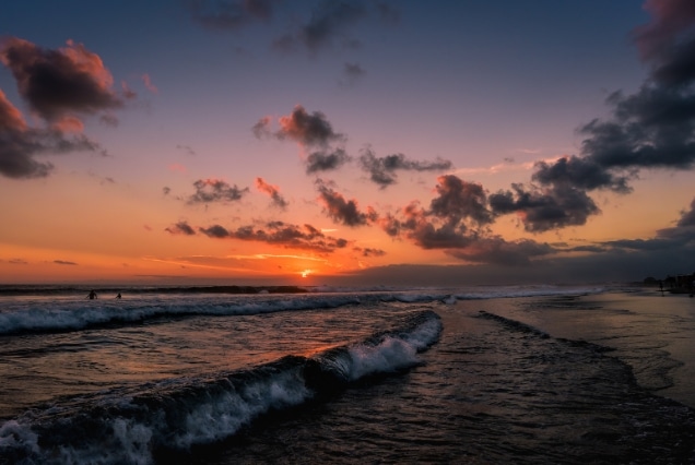 Dramatic sunset over Seminyak Beach, known for upscale beach clubs and nightlife in Bali 2026 itineraries.