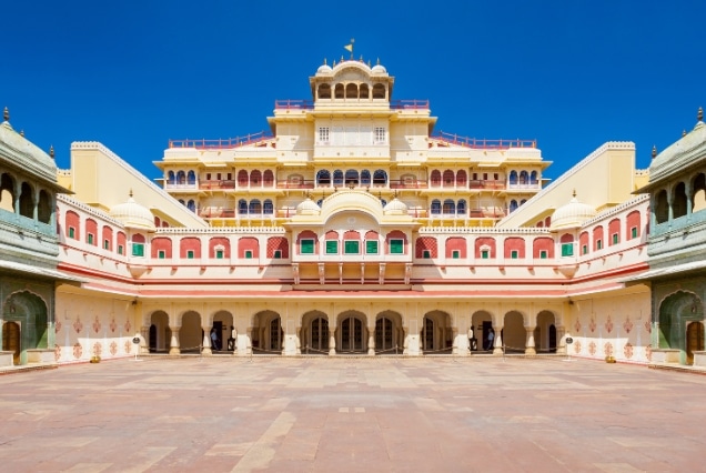 Architectural view of the ornate Peacock Gate in Pritam Niwas Chowk within the City Palace, Jaipur, featuring colorful frescoes and intricate carvings.