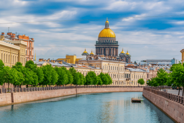 Scenic view of Saint Isaac's Cathedral and Moyka River canal in Saint Petersburg, Russia, during summer.