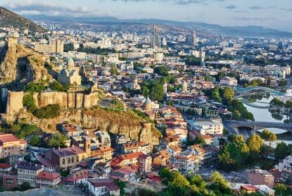 Panoramic view of Tbilisi, Georgia, featuring Narikala Fortress and the Bridge of Peace for Georgia holiday packages from Dubai.