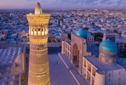 Kalyan Minaret and Po-i-Kalyan complex in Bukhara at dusk; a top destination for Uzbekistan holiday packages from Dubai.