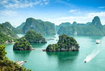 Scenic Ha Long Bay limestone islands and cruise boats, a top destination for Vietnam tour packages from Dubai, UAE.