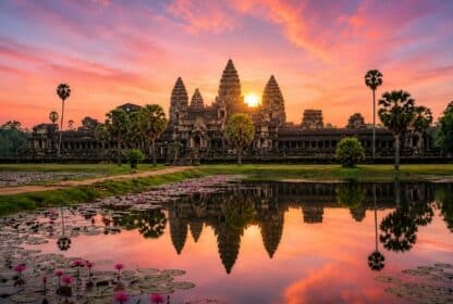 Angkor Wat temple sunrise reflected in a lily pond, featured in Cambodia Holiday Packages from Dubai, UAE.