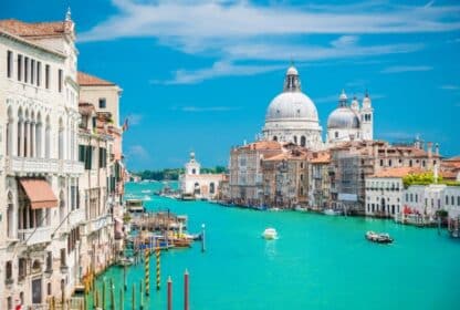Scenic view of Venice Grand Canal and Santa Maria della Salute basilica for Italy holiday packages from Dubai, UAE.