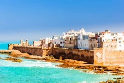 Historic stone ramparts and white buildings of Essaouira coast in Morocco. Ideal for Morocco holiday packages from Dubai, UAE.