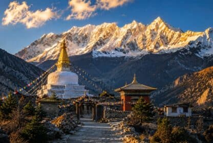 Scenic Buddhist stupa with prayer flags and snow-capped Himalayan mountains for Nepal Holiday Packages from Dubai, UAE.