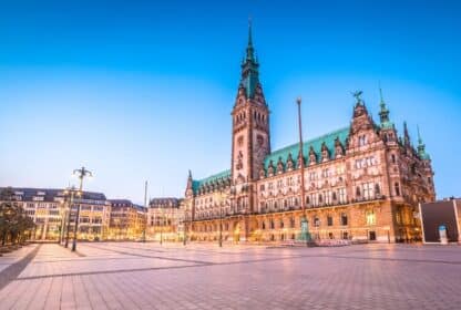 Hamburg Rathaus city hall in Germany at twilight, featured in premium Germany holiday packages from Dubai, UAE.