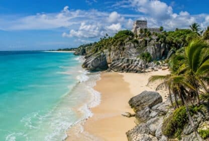 Tulum Mayan ruins on a cliff above turquoise Caribbean waters, popular in Mexico holiday packages from Dubai.