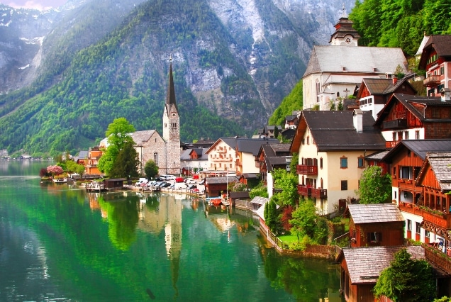 Hallstatt Austria village beside a crystal-clear alpine lake with mountain scenery