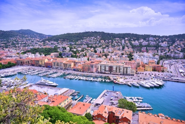 Nice France waterfront with colorful buildings, marina and Mediterranean coastline
