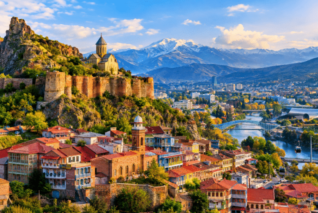 Tbilisi old town with Narikala Fortress and Caucasus mountains – Georgia travel guide 2026