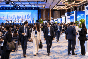 Corporate delegates walking through a MICE travel event at Dubai World Trade Centre, UAE