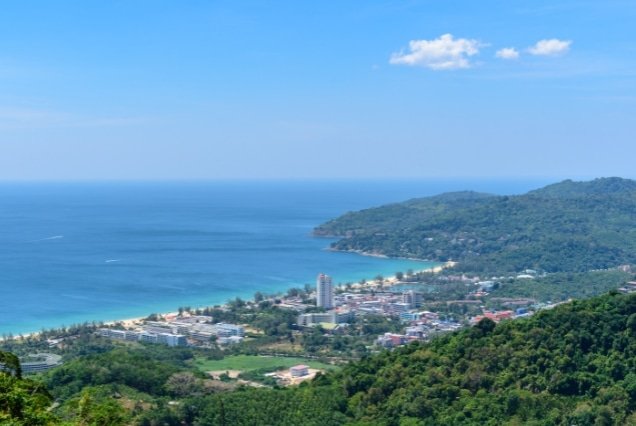 Aerial view of Phuket coastline and beach town from a hilltop – Phuket and Phi Phi Island Tour Package