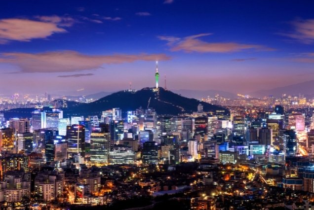 Seoul skyline and N Seoul Tower lit up at dusk – South Korea Tour Package